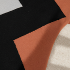 Women's geometric patchwork sweater with contrasting colour panels