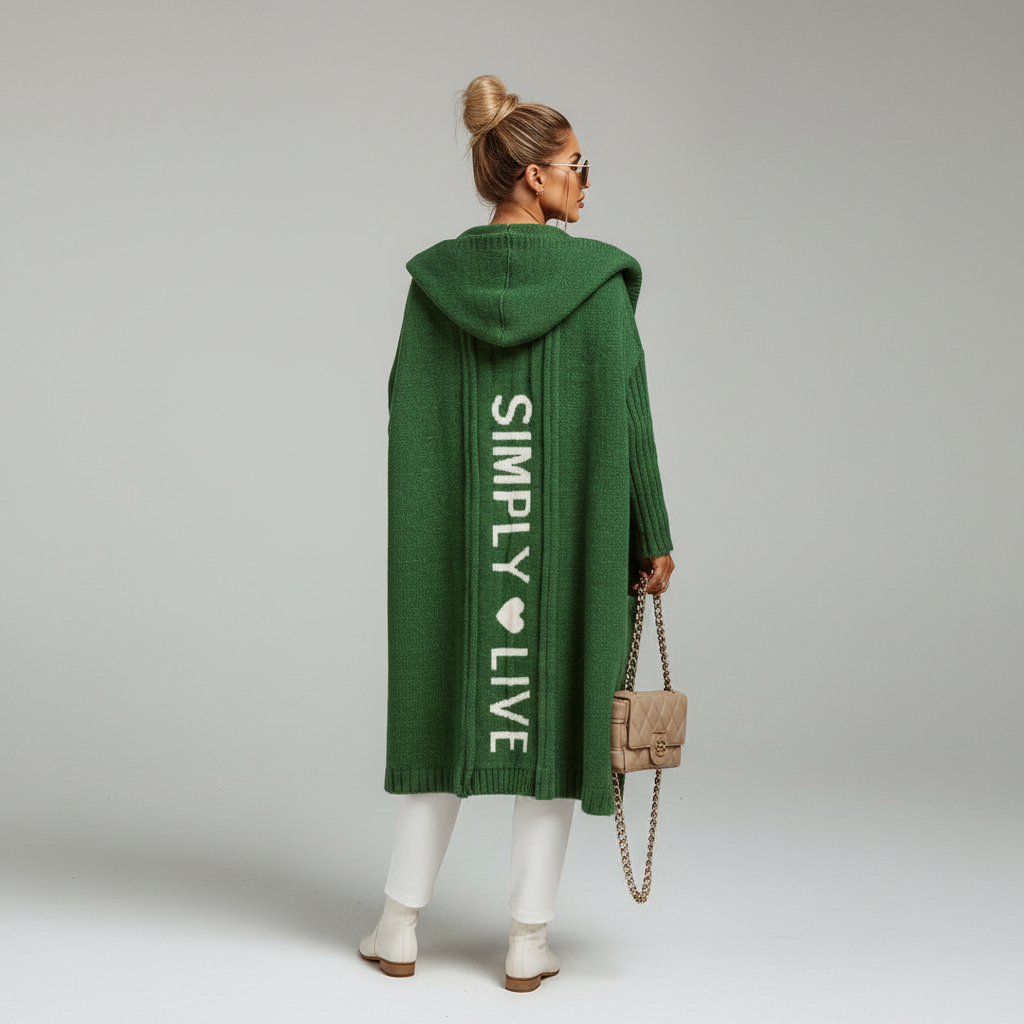 Woman wearing a longline hooded cardigan with vertical text and heart detail