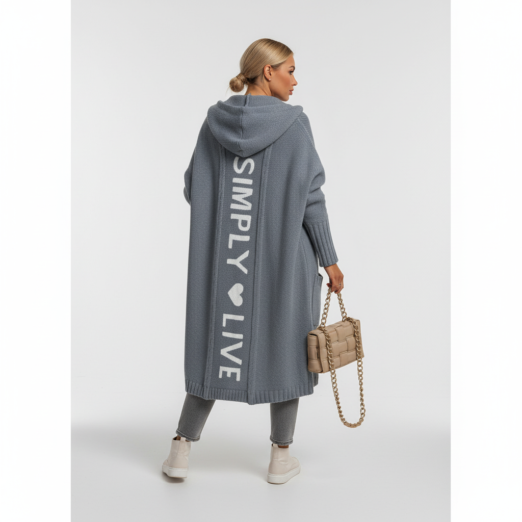Woman wearing a longline hooded cardigan with vertical text and heart detail