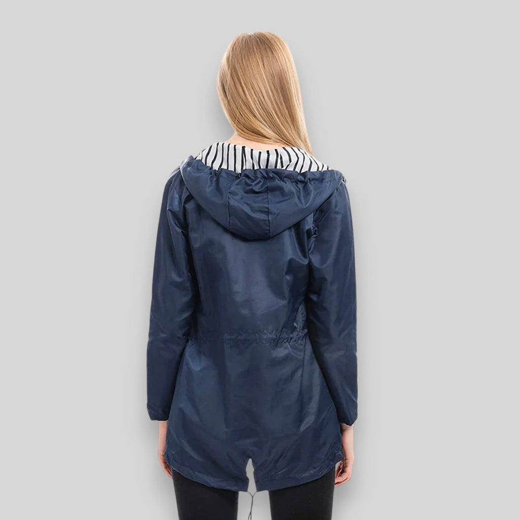 Women's hooded longline rain jacket with striped lining and zipped pockets