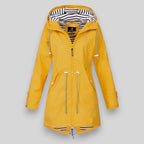 Women's hooded longline rain jacket with striped lining and zipped pockets