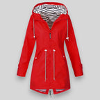 Women's hooded longline rain jacket with striped lining and zipped pockets