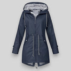 Women's hooded longline rain jacket with striped lining and zipped pockets