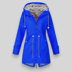 Women's hooded longline rain jacket with striped lining and zipped pockets
