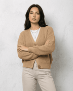 Women's textured V-neck cardigan with pearl-style trim and buttons