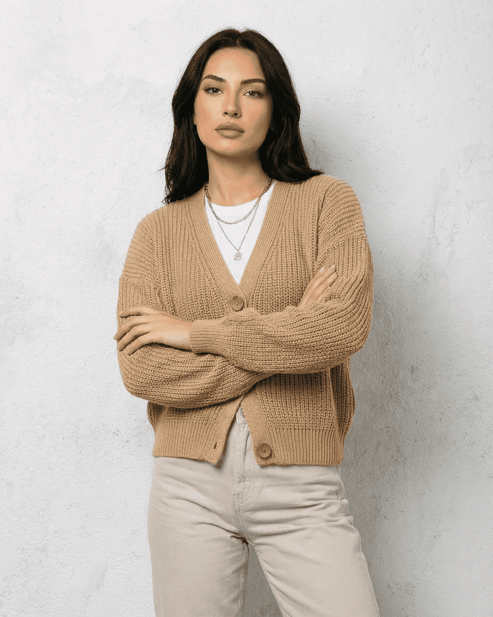 Women's textured V-neck cardigan with pearl-style trim and buttons