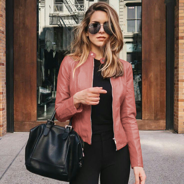 Woman wearing a fitted leather jacket with stand collar and zipper