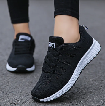 Women's low-top lace-up sneakers with textured knit-style uppers and flat soles