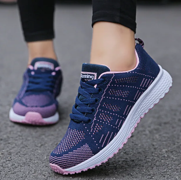 Women's low-top lace-up sneakers with textured knit-style uppers and flat soles