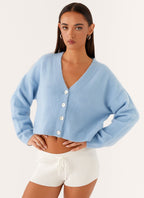 Women's blue cropped V-neck cardigan with long sleeves and button front