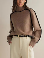 Women's oversized turtleneck sweater with contrasting trim and long sleeves