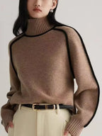Women's oversized turtleneck sweater with contrasting trim and long sleeves