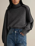 Women's oversized turtleneck sweater with contrasting trim and long sleeves