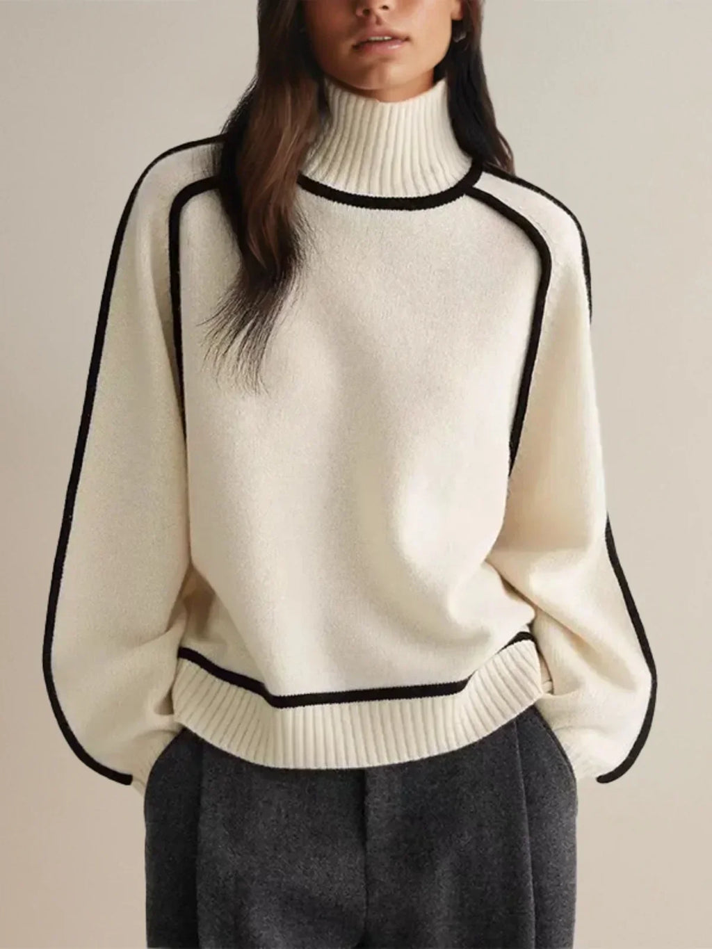 Women's oversized turtleneck sweater with contrasting trim and long sleeves