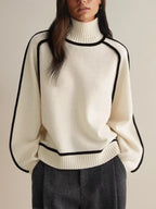 Women's oversized turtleneck sweater with contrasting trim and long sleeves