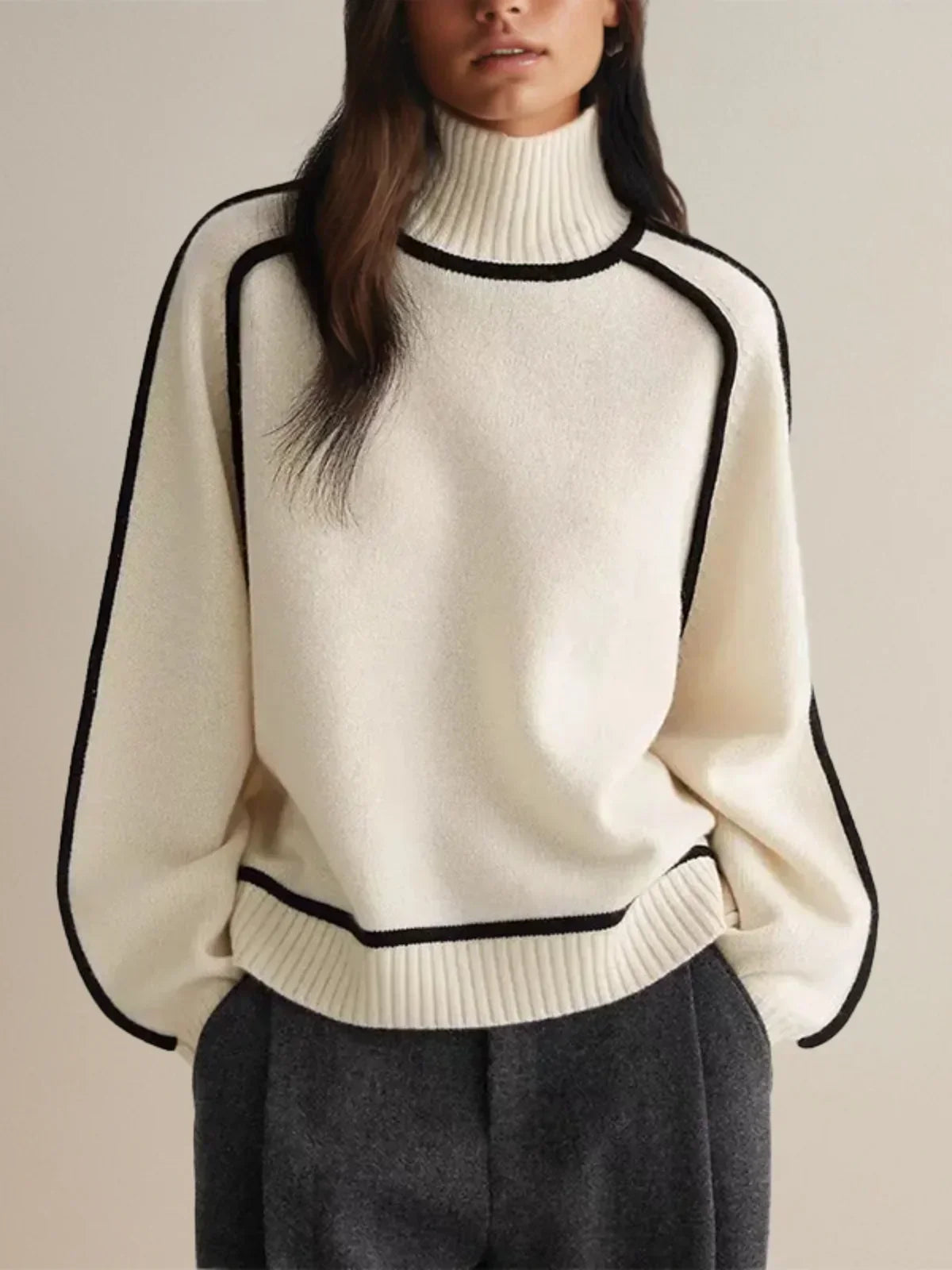 Women's oversized turtleneck sweater with contrasting trim and long sleeves