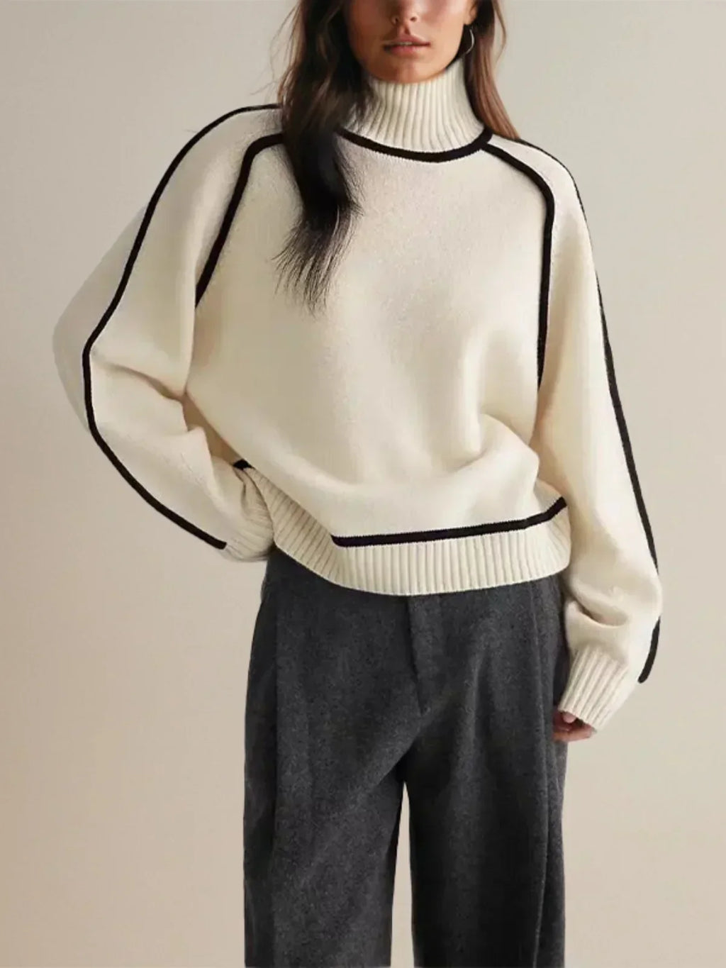 Women's oversized turtleneck sweater with contrasting trim and long sleeves