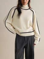 Women's oversized turtleneck sweater with contrasting trim and long sleeves