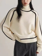 Women's oversized turtleneck sweater with contrasting trim and long sleeves