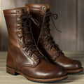 Unisex mid-calf lace-up combat boots with round toes and treaded soles