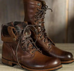 Unisex mid-calf lace-up combat boots with round toes and treaded soles