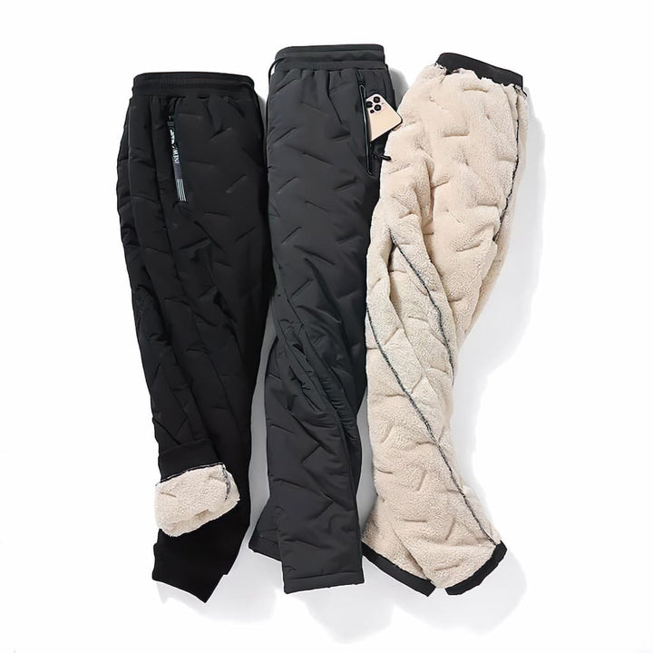 Women's quilted jogger trousers with drawstring waist, zipped pockets and ribbed ankle cuffs