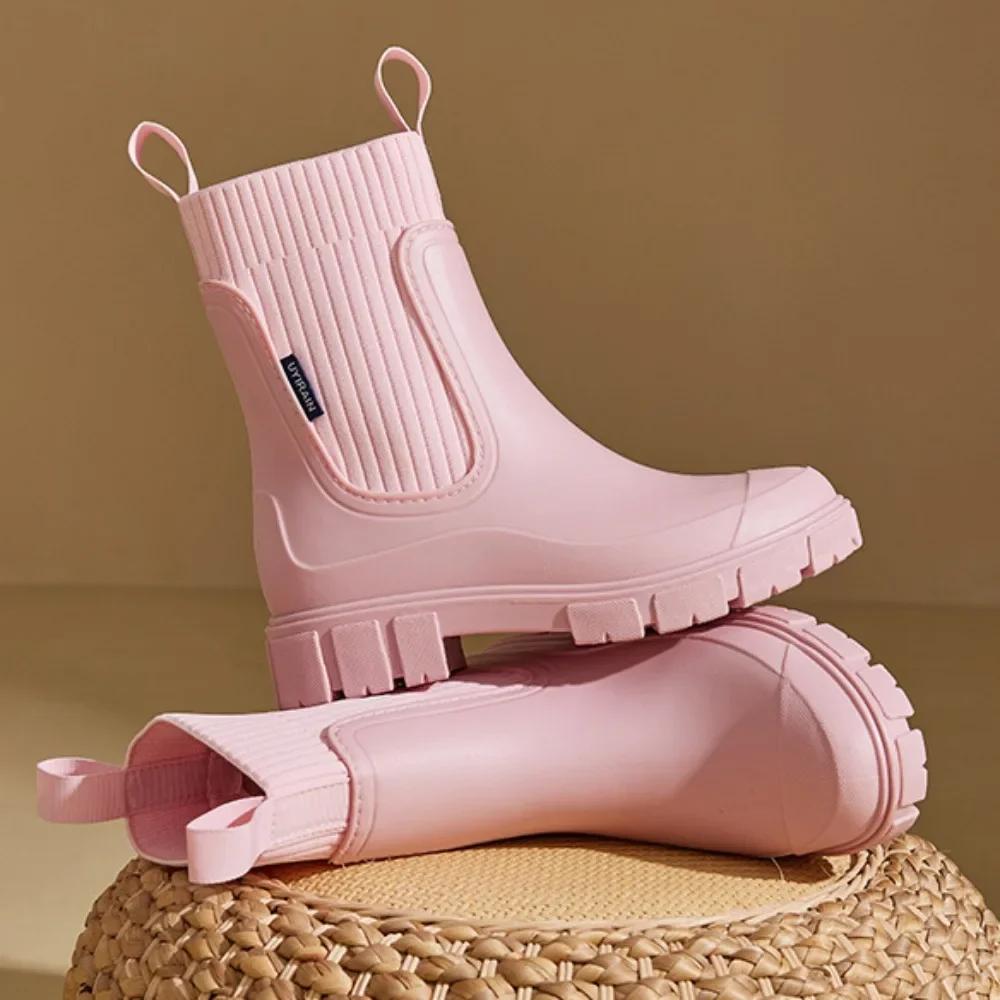 Women's Chelsea rain boots with elastic panels and chunky lug soles