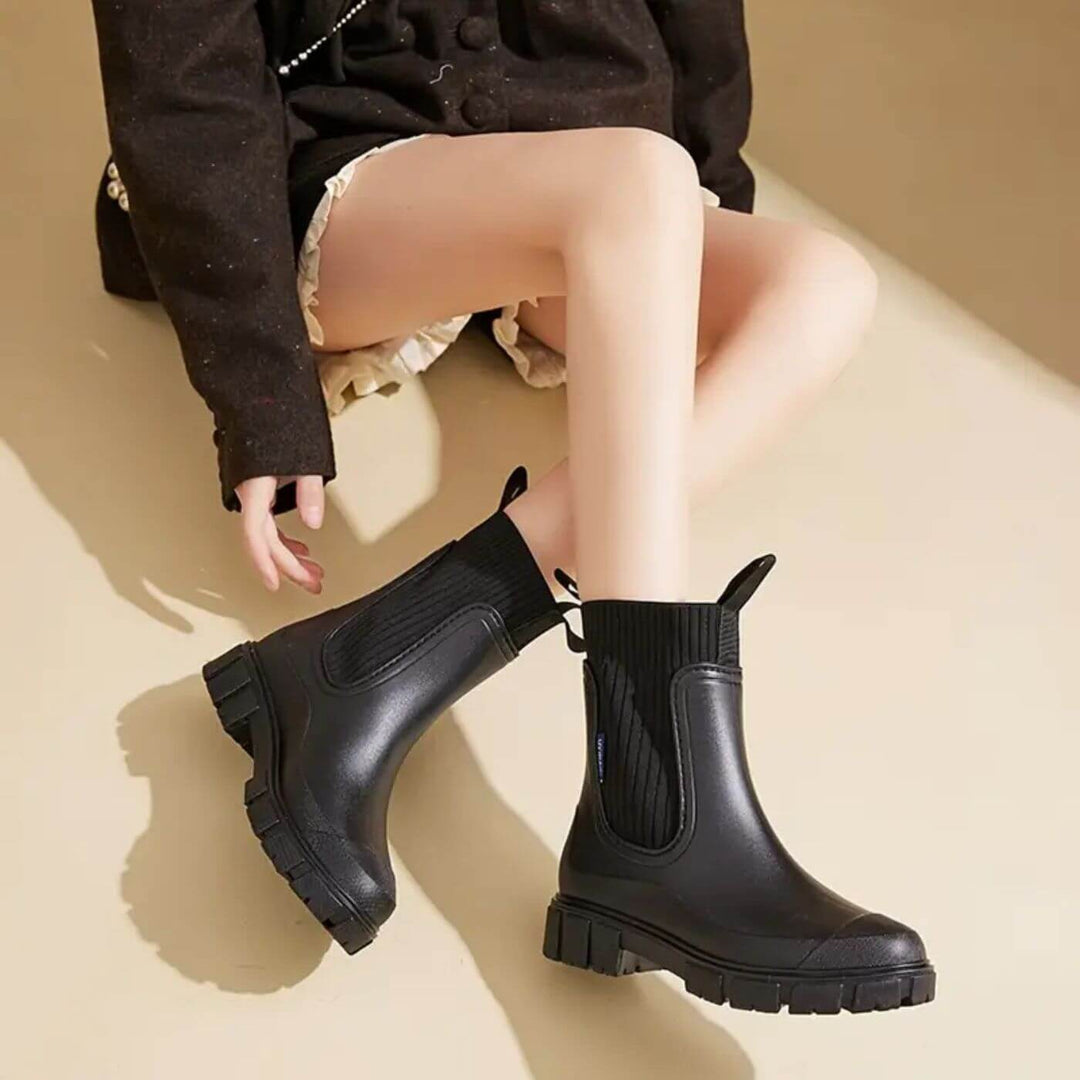 Women's Chelsea rain boots with elastic panels and chunky lug soles