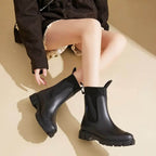 Women's Chelsea rain boots with elastic panels and chunky lug soles