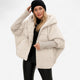 Women's oversized hooded quilted jacket with plush panels and ribbed cuffs