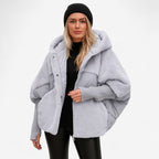 Women's oversized hooded quilted jacket with plush panels and ribbed cuffs