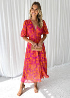 Women's pink and orange floral midi dress with puff sleeves