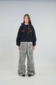 Unisex hooded sweatshirt with long sleeves, front pouch pocket and chest logo details