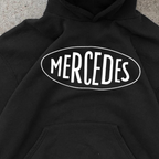Black pullover hoodie with white Mercedes chest graphic and kangaroo pocket
