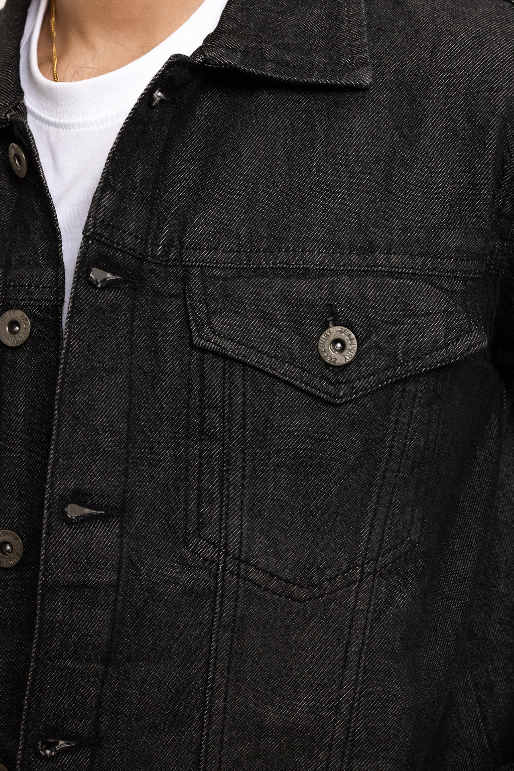 Men's black button-front utility jacket with pointed collar and flap pockets