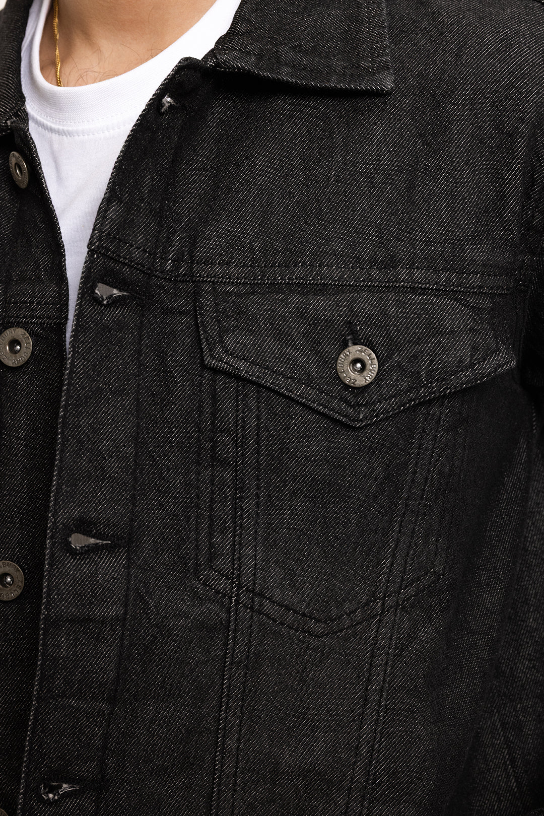 Men's black button-front utility jacket with pointed collar and flap pockets