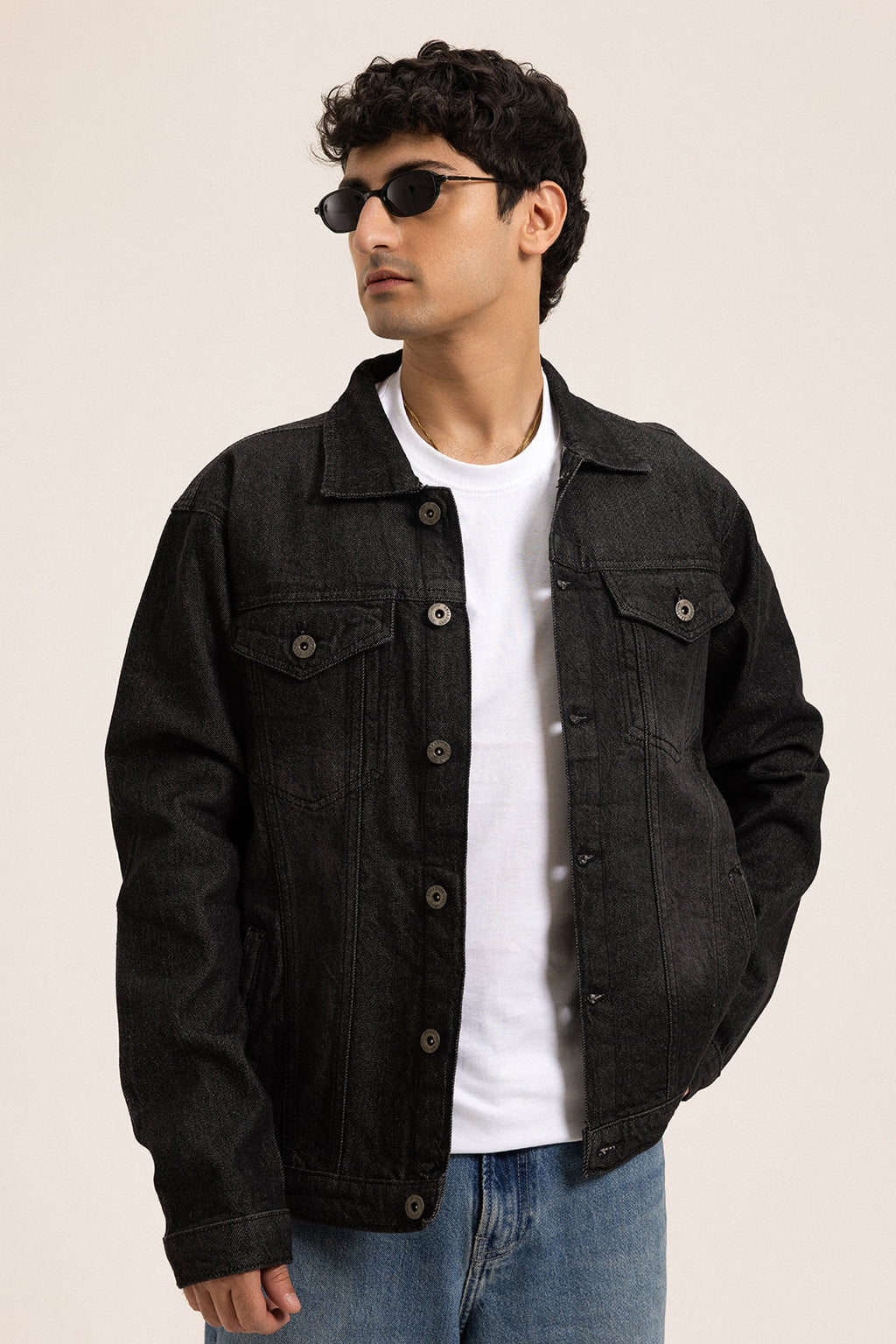 Men's black button-front utility jacket with pointed collar and flap pockets
