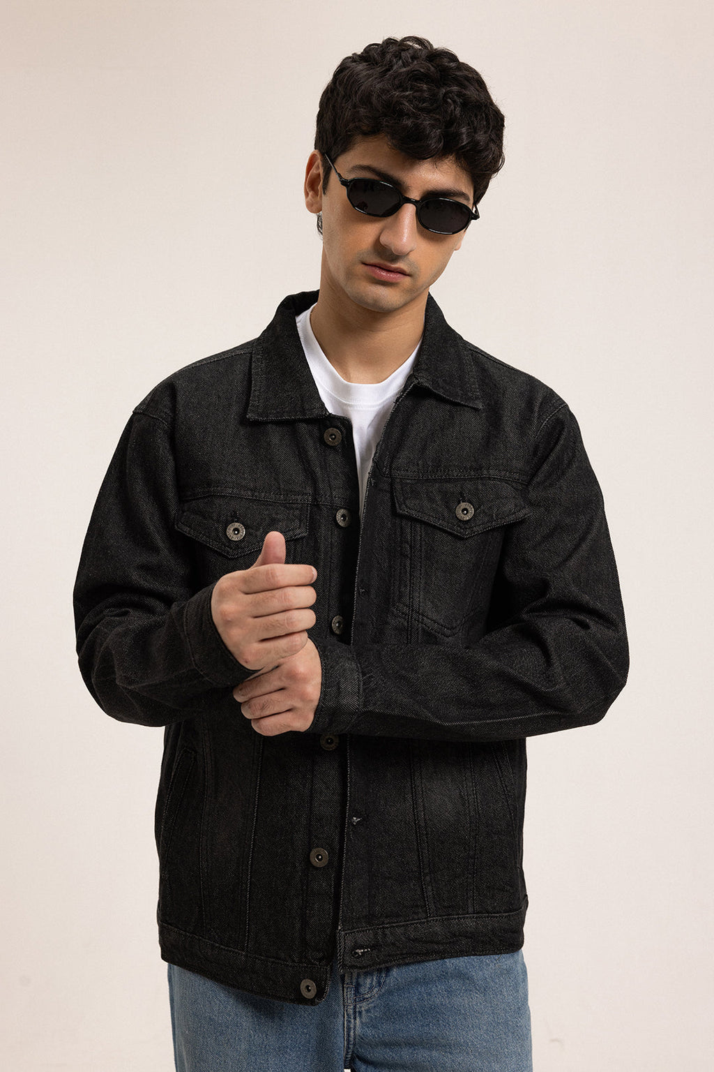 Men's black button-front utility jacket with pointed collar and flap pockets
