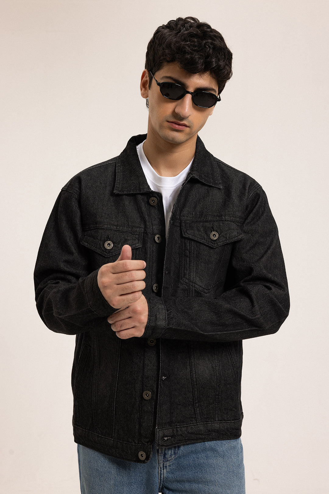 Men's black button-front utility jacket with pointed collar and flap pockets