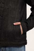 Men's black button-front utility jacket with pointed collar and flap pockets