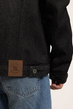 Men's black button-front utility jacket with pointed collar and flap pockets