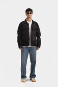 Men's black button-front utility jacket with pointed collar and flap pockets