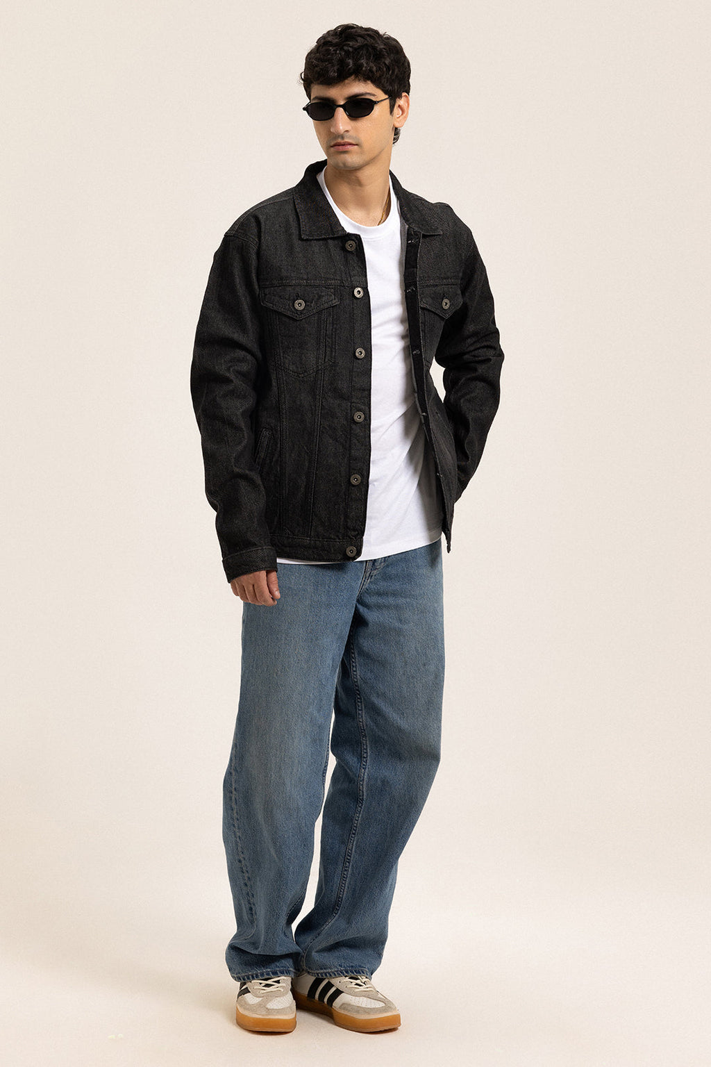 Men's black button-front utility jacket with pointed collar and flap pockets