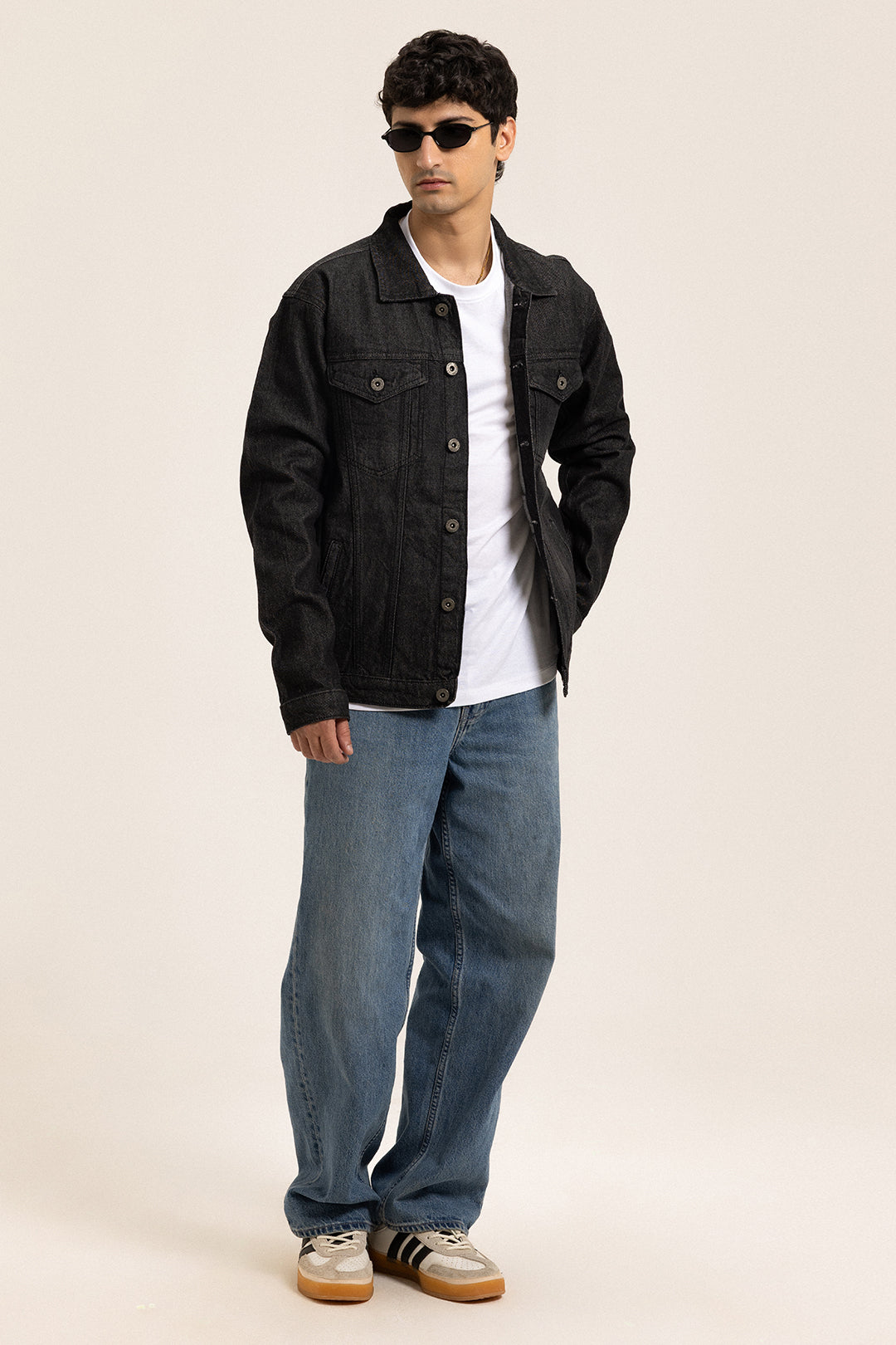Men's black button-front utility jacket with pointed collar and flap pockets