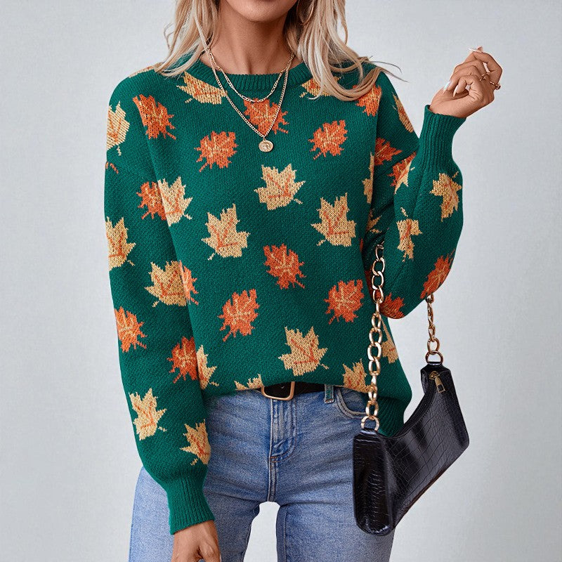 Women's crew neck sweater with repeated maple leaf pattern and long sleeves
