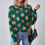 Women's crew neck sweater with repeated maple leaf pattern and long sleeves