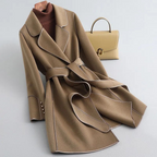 Women's belted trench coat with notched lapels, contrast piping and long sleeves