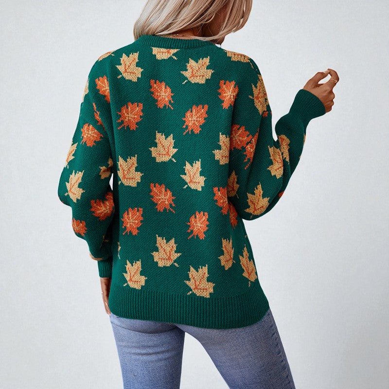 Women's crew neck sweater with repeated maple leaf pattern and long sleeves