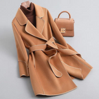 Women's belted trench coat with notched lapels, contrast piping and long sleeves
