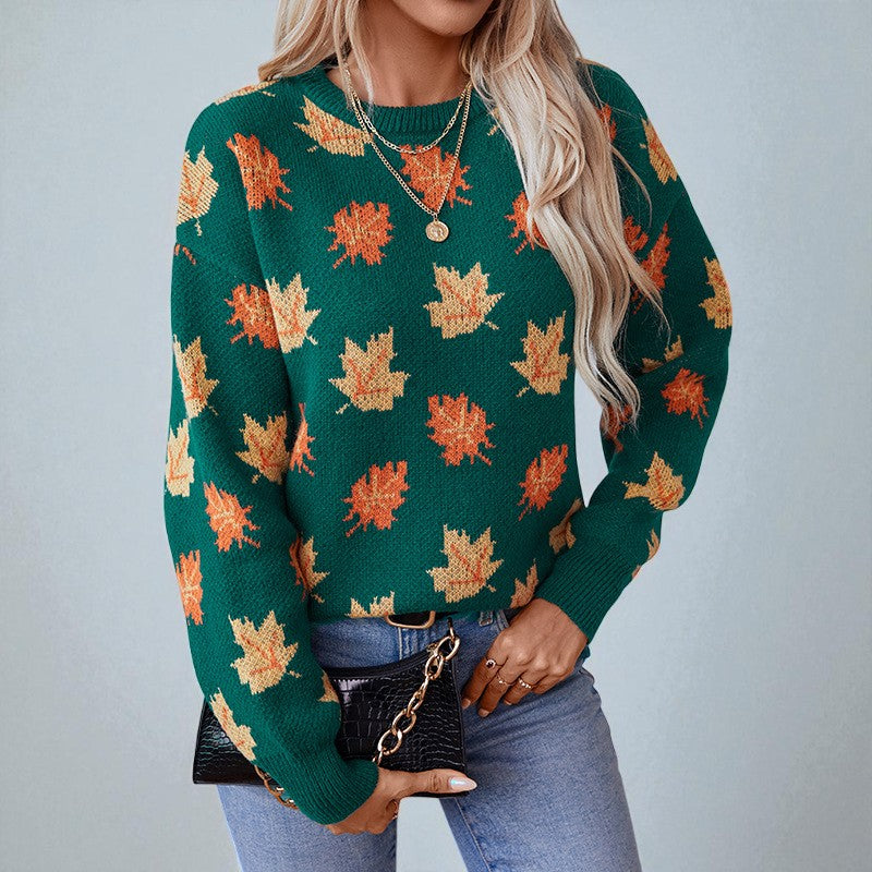 Women's crew neck sweater with repeated maple leaf pattern and long sleeves